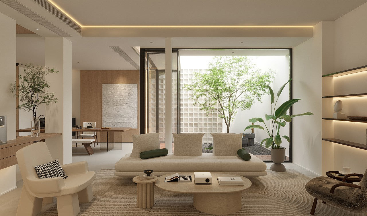 Modern living room with white sofa, coffee table, and decorative items.